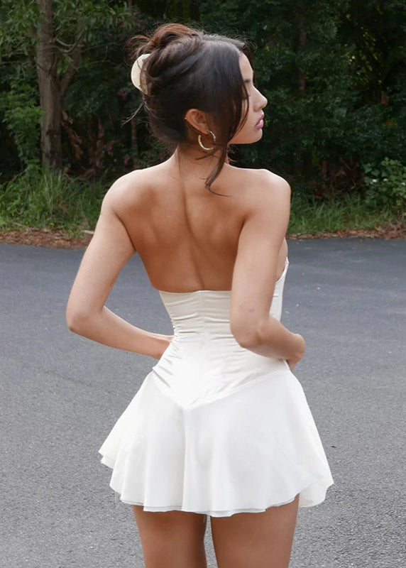 Beige corset dress outdoor back view