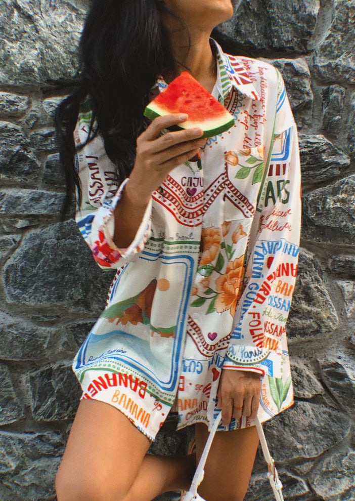Two-piece set with bold botanical pattern, eating watermelon
