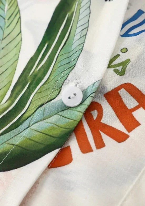 Two-piece set with tropical print, button detail close-up