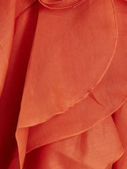 Close-up of orange maxi dress ruffles, showcasing texture and detail