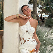 White crochet mini dress with floral pattern leaning pose