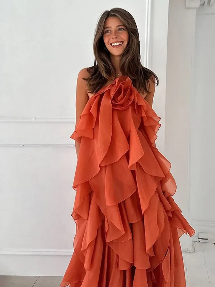 Orange maxi dress with ruffles and layered design, front view