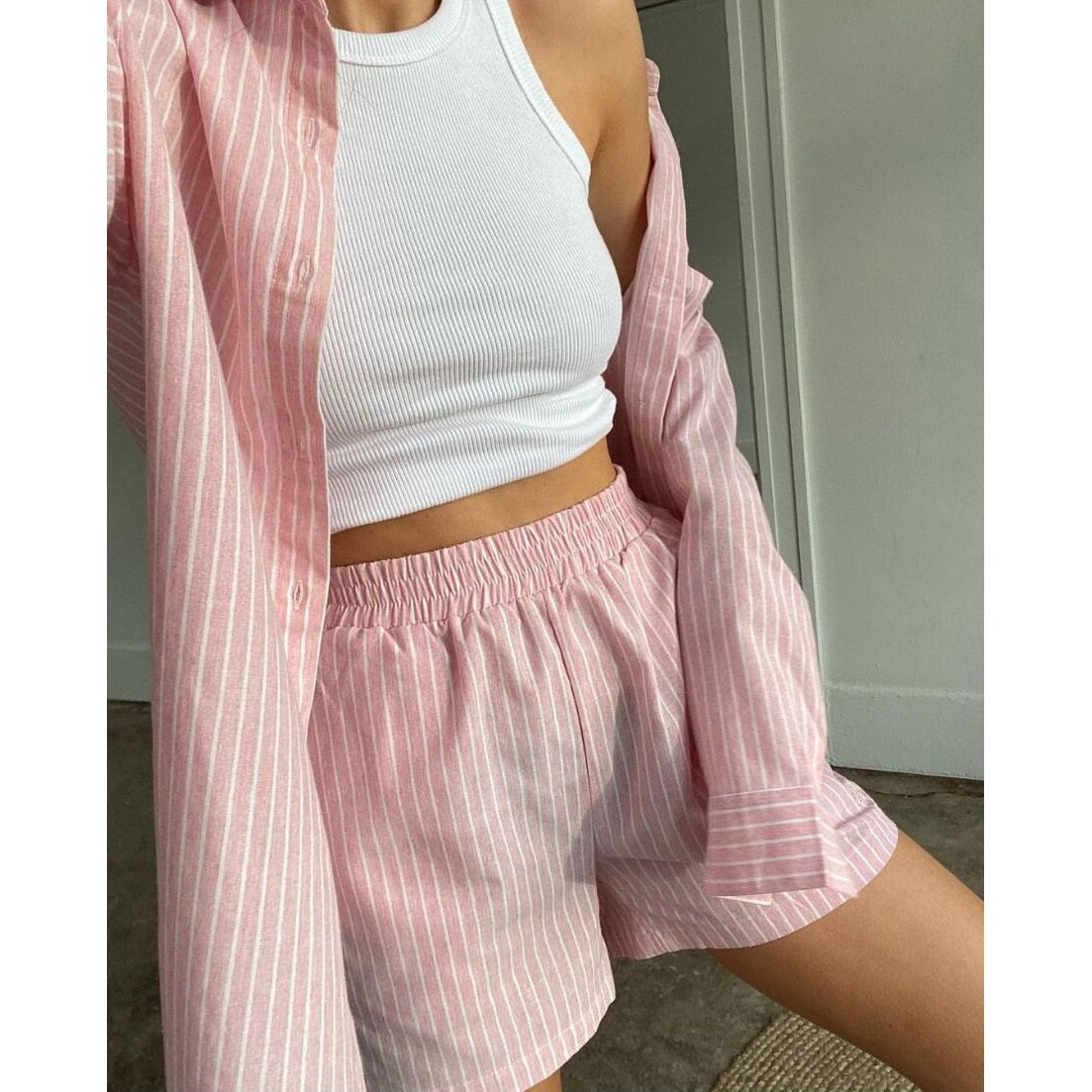 Pink striped shirt and shorts set close-up detail