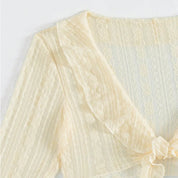 Beige sheer cover-up close-up detail view