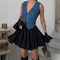 Black pleated skirt with blue denim vest side view