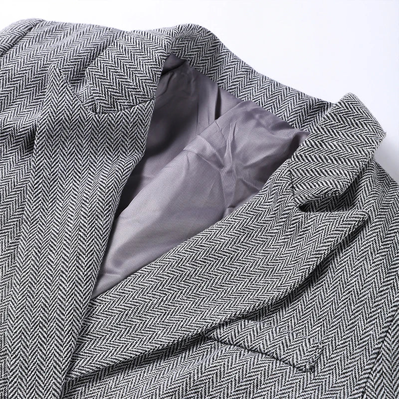 Blazer met herringbone patroon en grijze binnenzijde detail shot