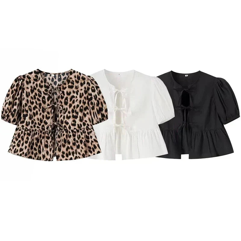 Blouses in leopard print, white, and black puff sleeves comparison