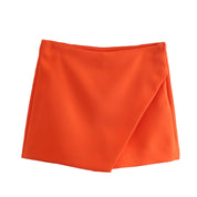 Korte broek met roklook oranje detailopname