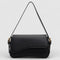 Black shoulder bag with textured leather and gold hardware front view