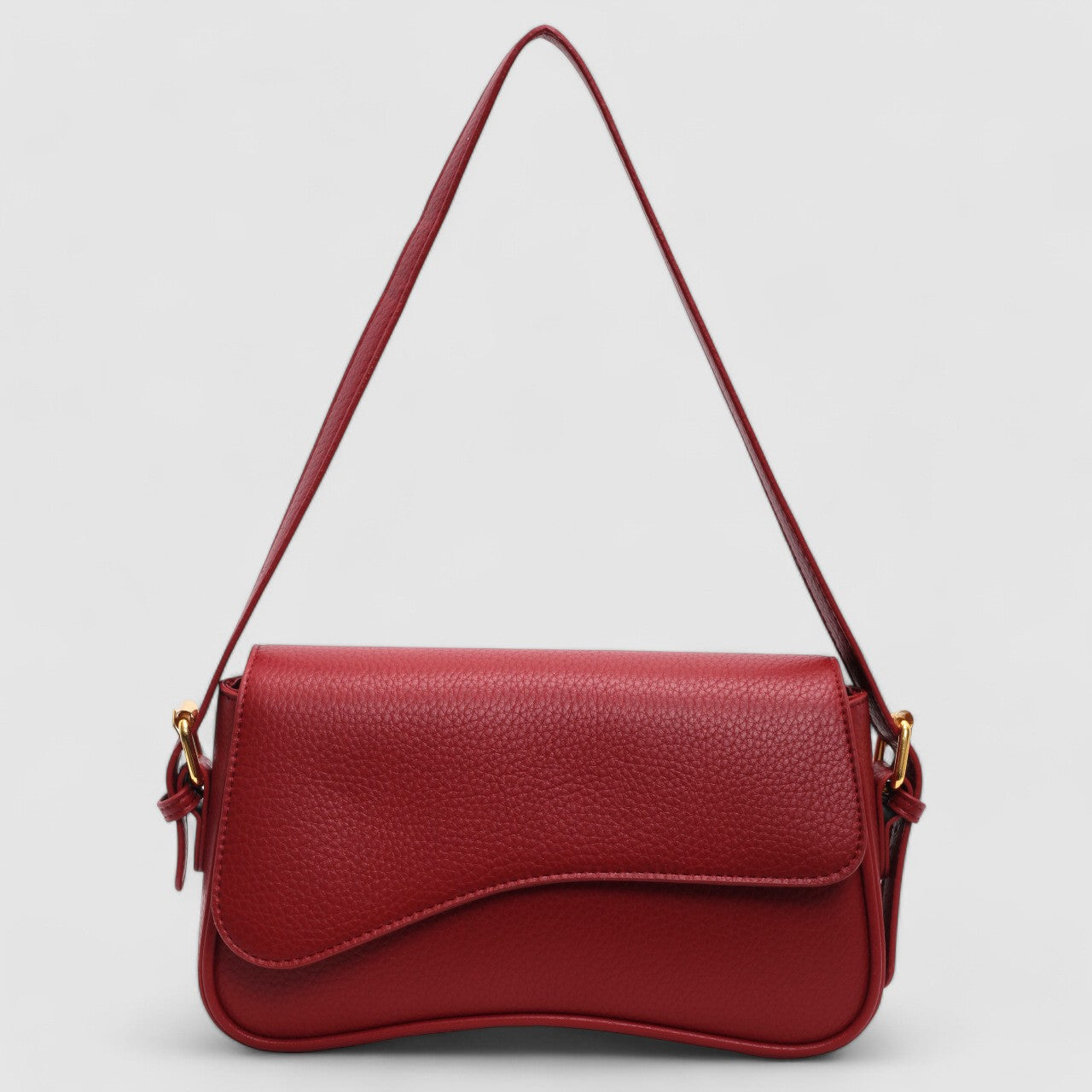 Red shoulder bag with textured leather and gold hardware front view