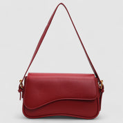 Red shoulder bag with textured leather and gold hardware front view