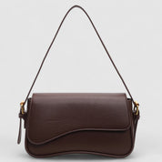 Brown shoulder bag with textured leather and gold hardware front view