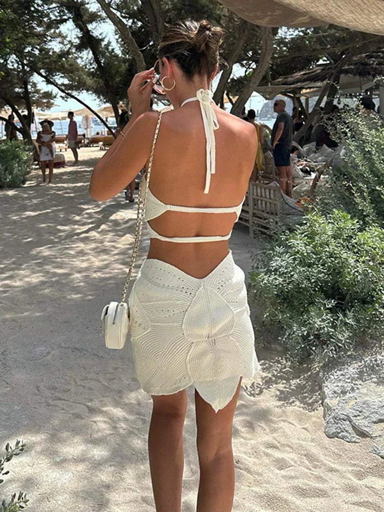 White crochet mini dress with floral pattern back view