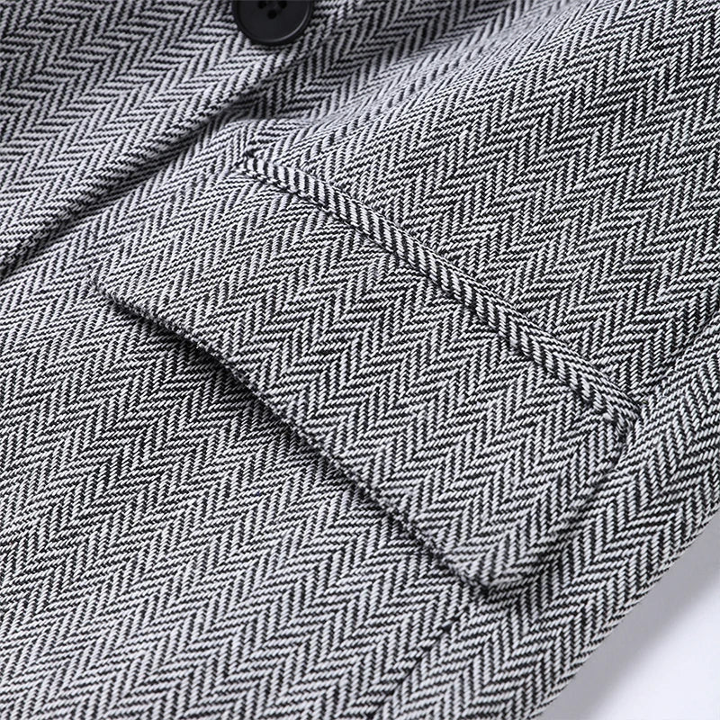 Blazer met herringbone patroon grijs detail shot