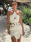 White crochet mini dress with floral pattern front view