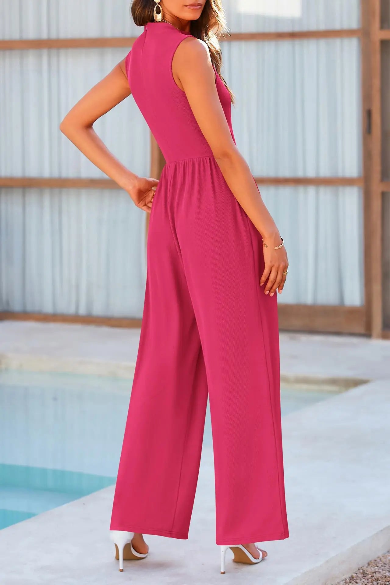 Pink jumpsuit with wide legs, side view