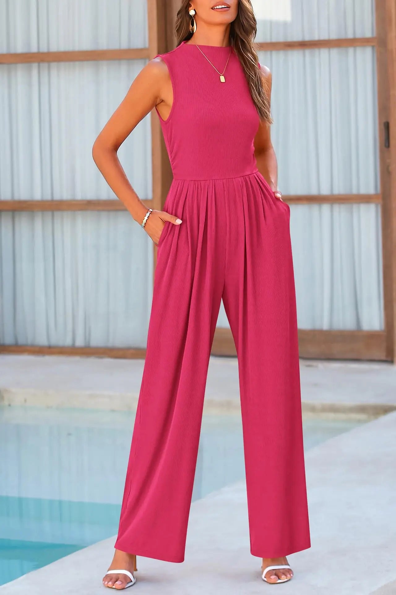 Pink jumpsuit with wide legs and pockets, front view