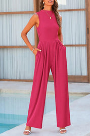 Pink jumpsuit with wide legs and pockets, front view