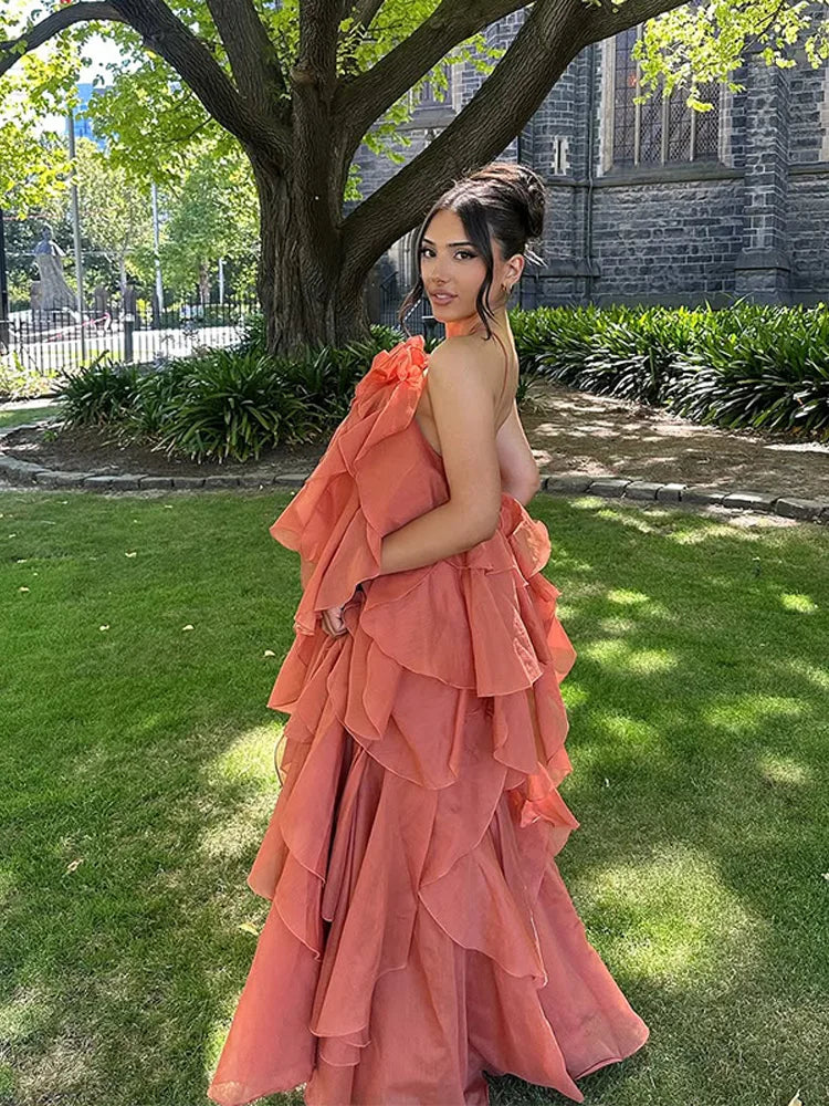 Orange maxi dress with ruffles, outdoor side view highlighting layers