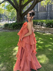 Orange maxi dress with ruffles, outdoor side view highlighting layers