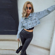 Light blue cropped denim jacket with distressed details side profile view