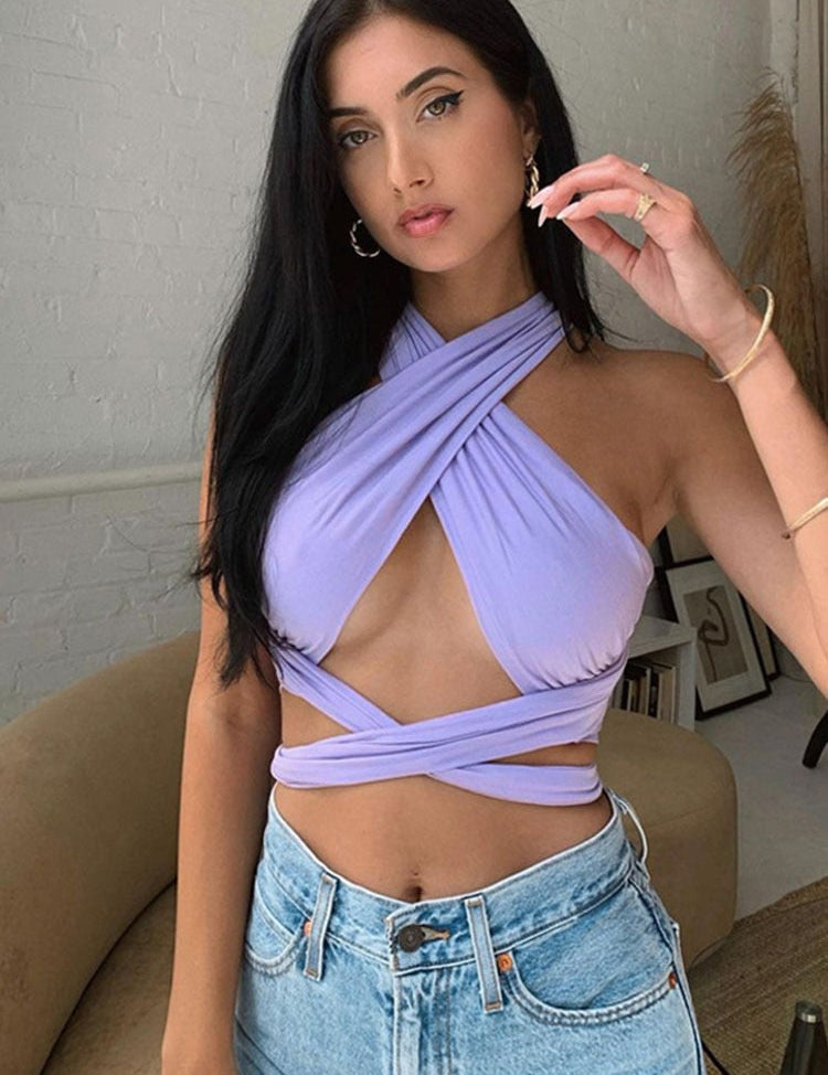 Lavender crop top with criss-cross halter indoor setting