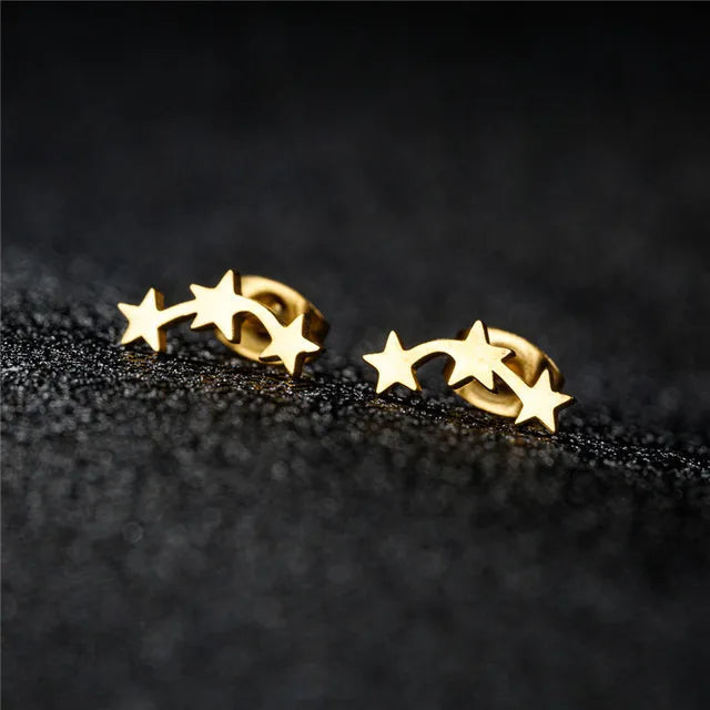 Gold geometric star earrings front view
