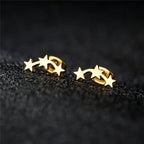 Gold geometric star earrings front view