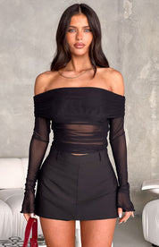 Black off-shoulder mesh top with sheer sleeves and skirt set front view with white background