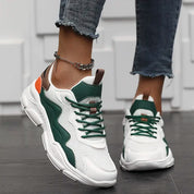 Sneakers wit-groen met oranje details, vooraanzicht