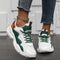 Sneakers wit-groen met oranje details, vooraanzicht