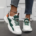 Sneakers wit-groen met oranje details, vooraanzicht