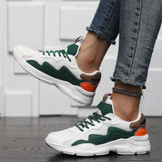 Casual sneakers wit, groen en oranje met textiel en rubber detail shot