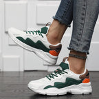 Casual sneakers wit, groen en oranje met textiel en rubber detail shot