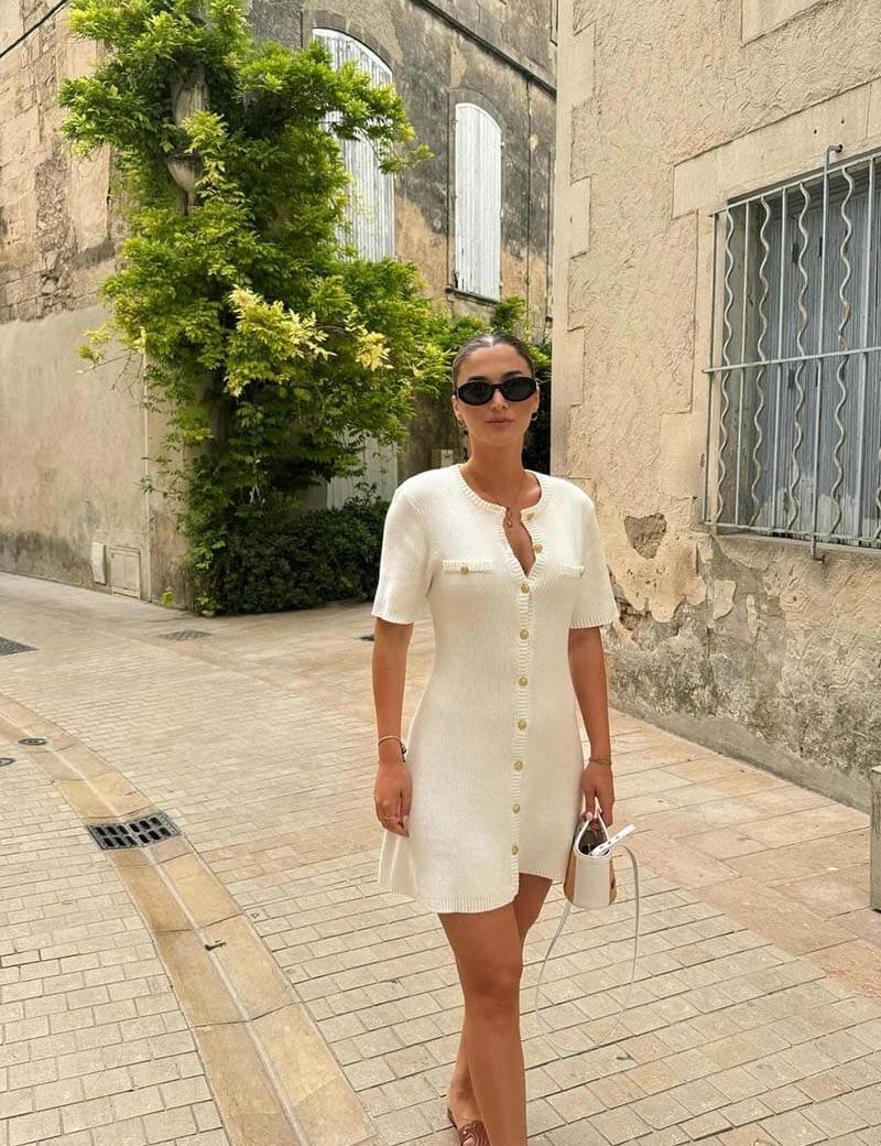 White knitted dress with gold buttons front view
