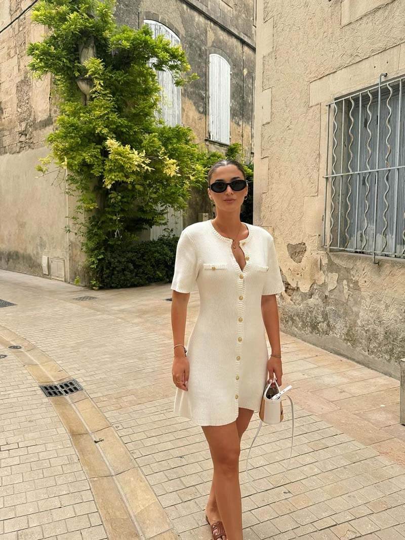 White knitted dress with gold buttons front view