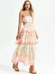 Maxi dress with floral pattern and lace details, pink trim, side view with wedges