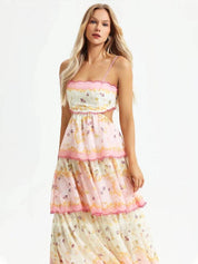 Maxi dress with floral print and lace details, pink trim, front view