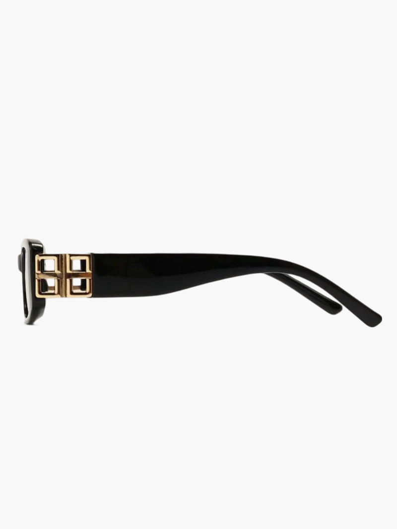 Black acetate sunglasses with gold logo detail, arm close-up
