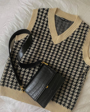Black crocodile-print shoulder bag styled with sweater