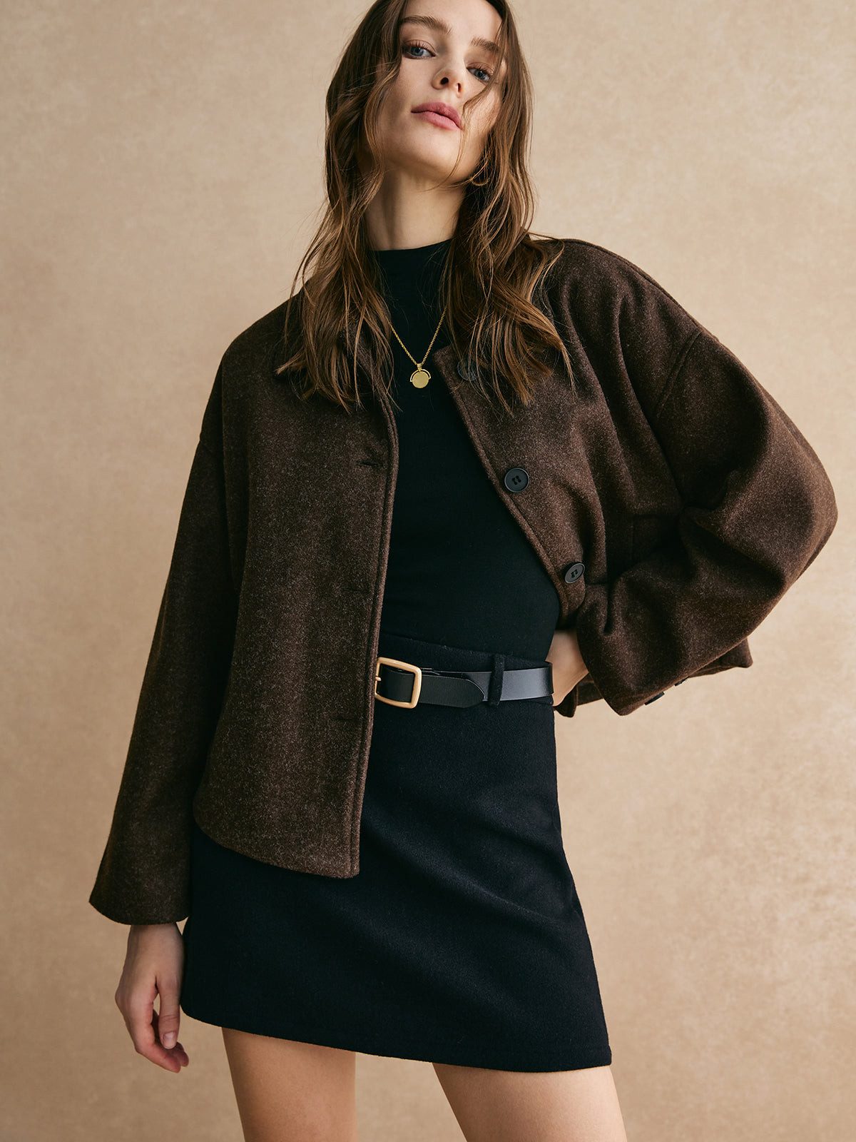 Brown blazer boxy fit side view with model standing