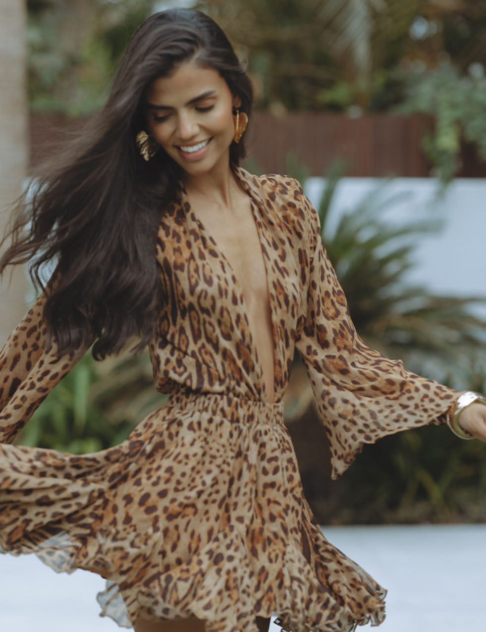 Mini dress with leopard print flowing sleeves front view
