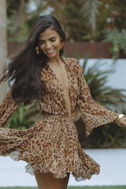 Mini dress with leopard print flowing sleeves front view
