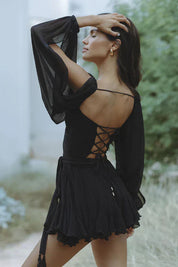 Black wrap-bodice dress back detail