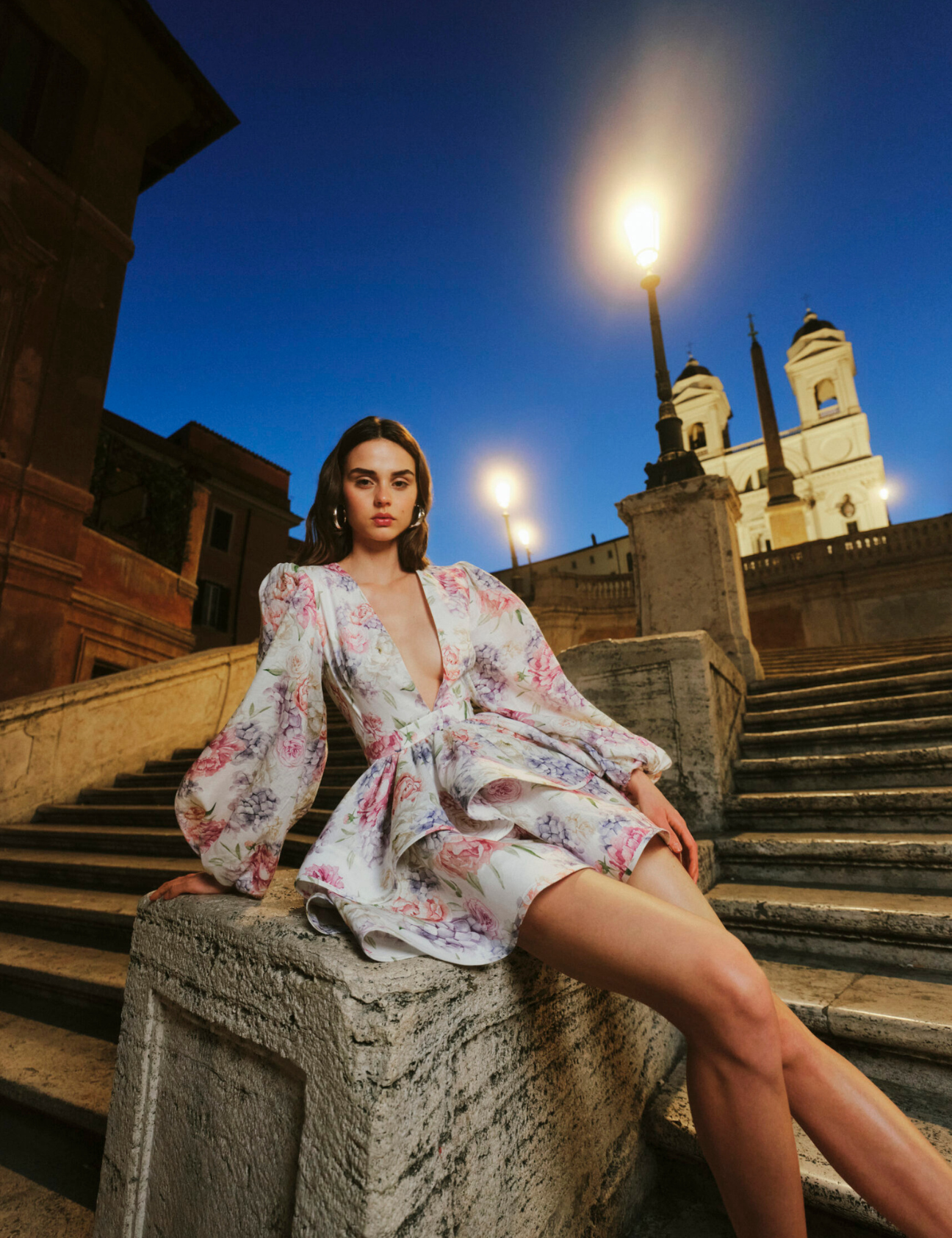 Summer dress with floral print and bell sleeves worn outdoors