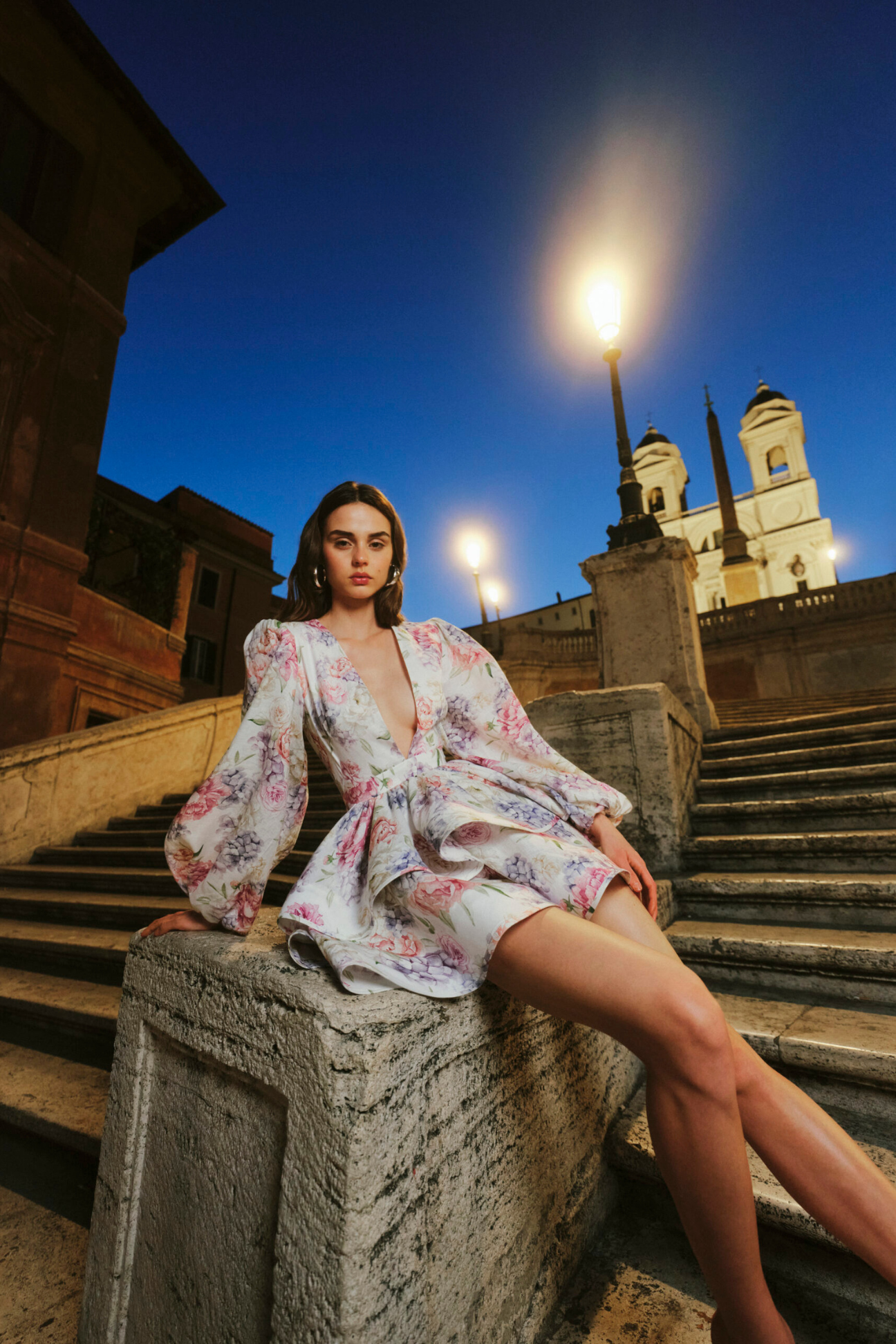 Summer dress with floral print and bell sleeves worn outdoors