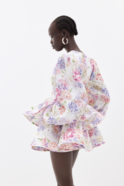 Summer dress with floral print and bell sleeves side view