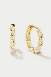 Gold hoop earrings with pearl accents, front view on white background