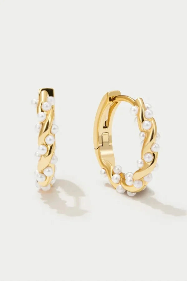 Gold hoop earrings with pearl accents, front view on white background