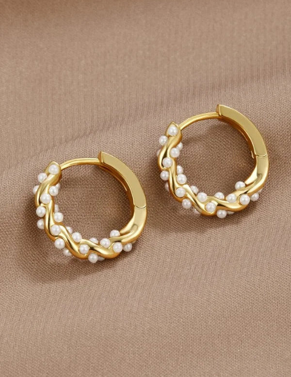 Gold hoop earrings with pearl accents, front view